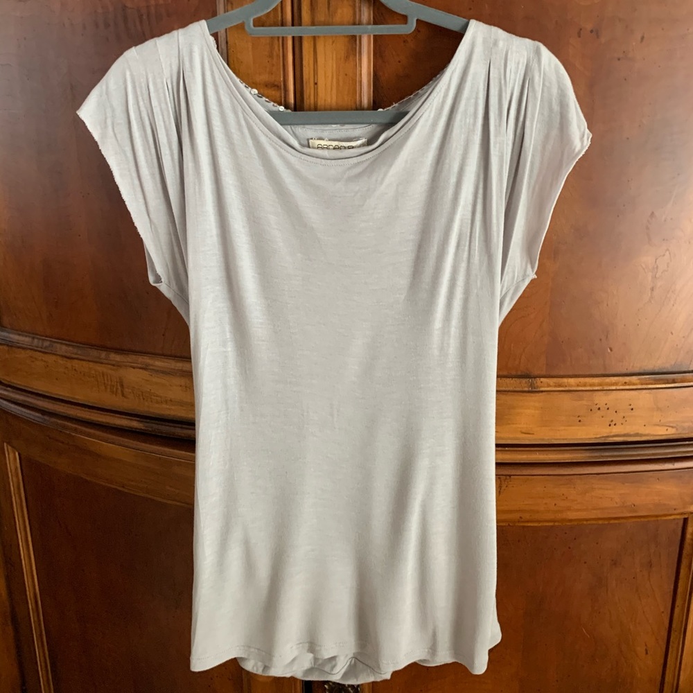 Arden B. Evening Blouse with open back design.